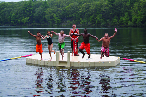 children jumping off dock into water smaller